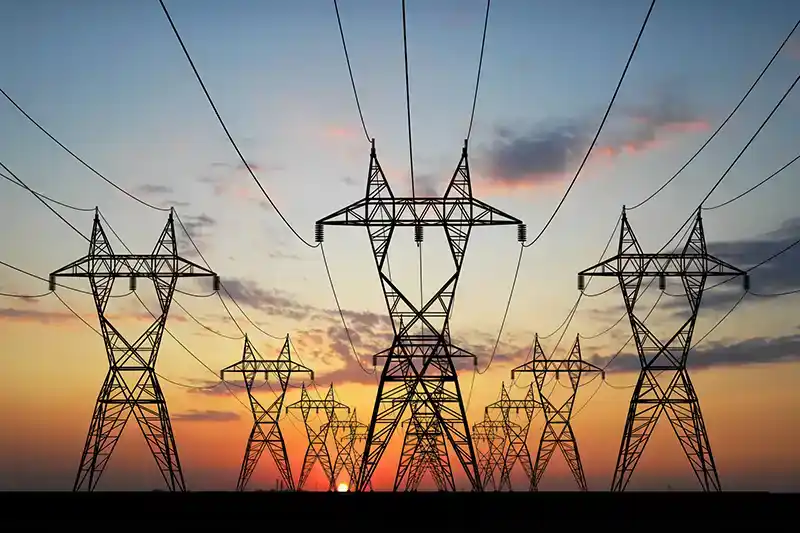 High-voltage power transmission lines delivering electricity