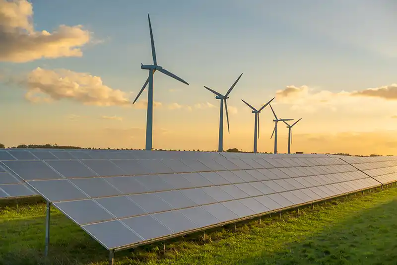 Solar panels and wind turbines generating clean renewable energy